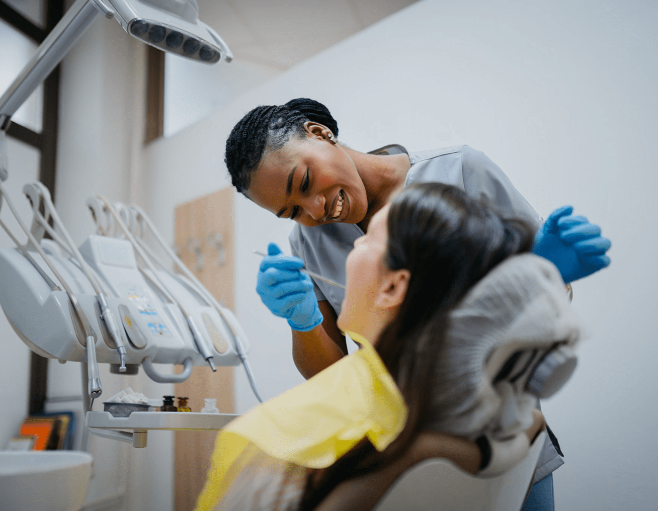 Dentist in gloves examining patient